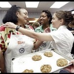 Winning contestant Patricia Walls receives congratulations from fellow bakeoff contestants, Stacey Blisset Boyd (right) and Pamela Parker (center) after she won 1st prize in the chocolate chip cookie bakeoff. YWCA Chocolate Chip cookie bakeoff took place at the Stratford University Culinary Arts in Falls Church.